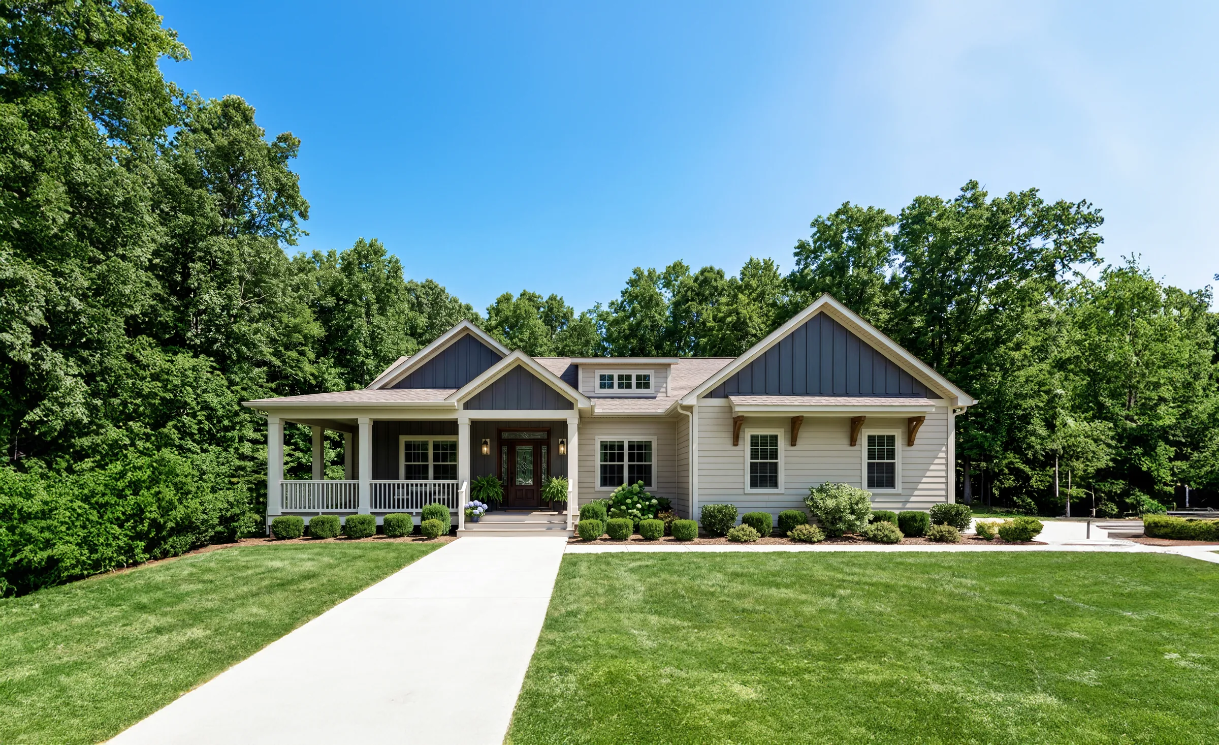 Finished ranch home with a front porch and lawn